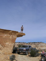 Chris standing on an overhang